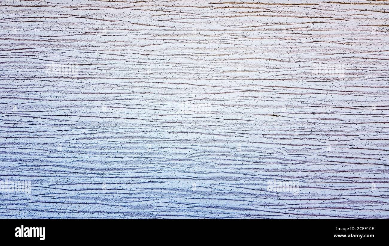 White textured plaster texture. Decorative wall covering with horizontal stripes. Background for text. Light modern abstract background Stock Photo