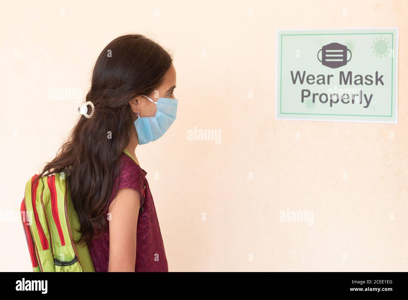 Young girl Student adjusting mask by seeing wear mask properly notice