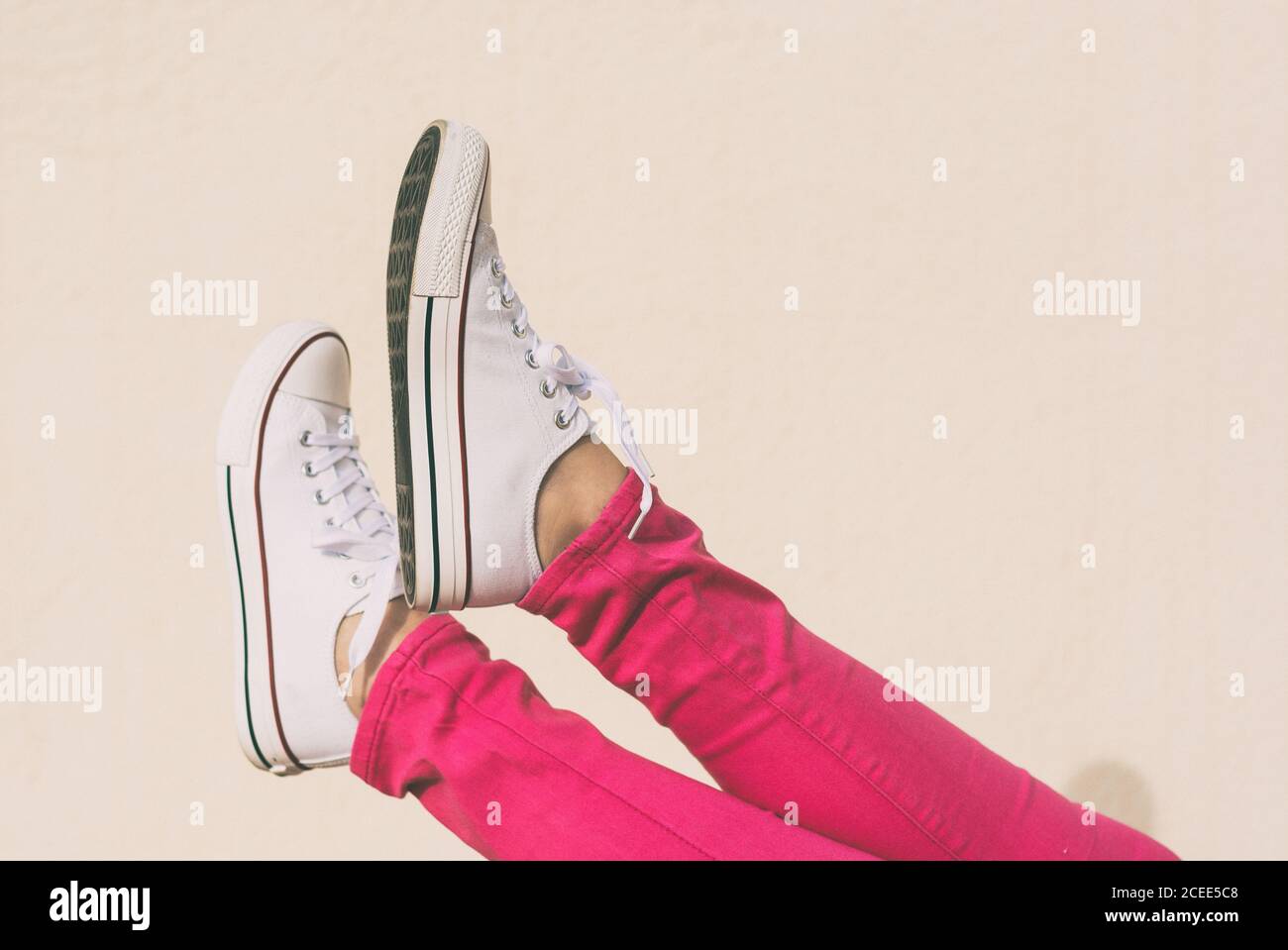 Woman with canvas shoes and pink jeans, Ideal fashion for spring and summer  days Stock Photo - Alamy