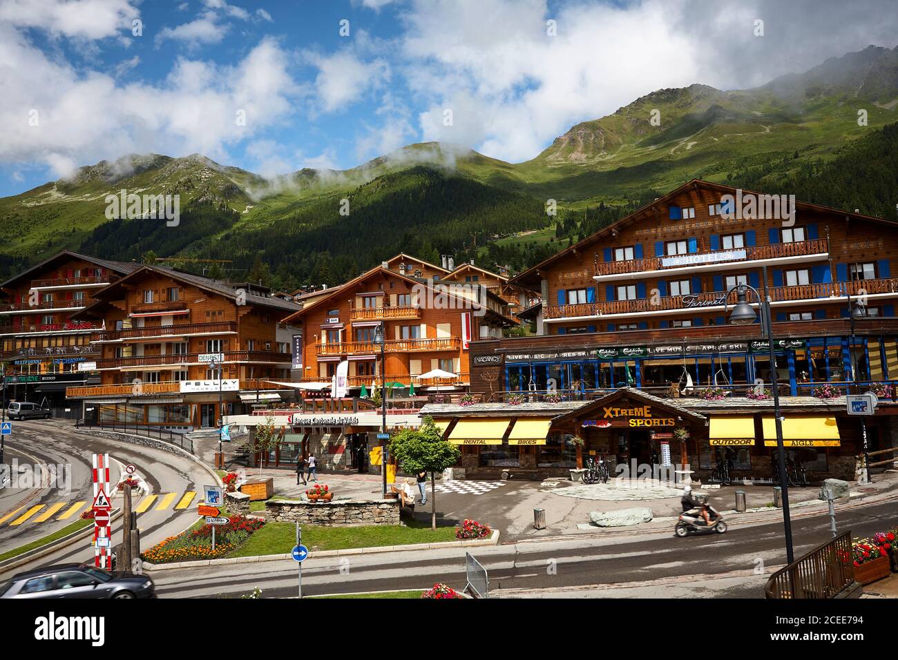 Big houses and shops in Verbier, Switzerland. Blue sky and cloudy weather in the alpes. Stock Photo