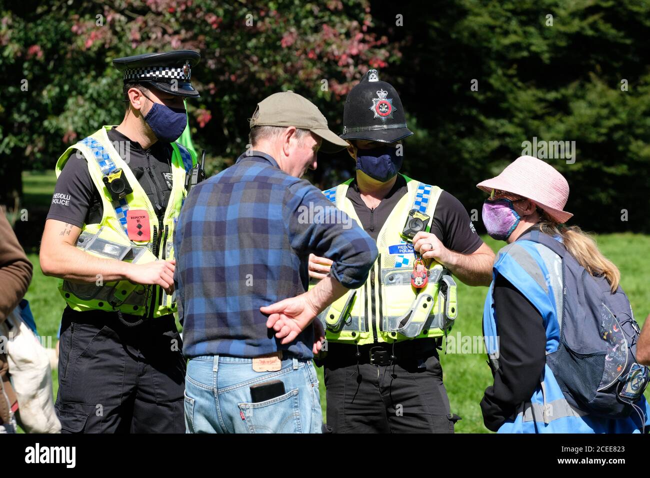 Cardiff, Wales, UK - Tuesday 1st September 2020 - Extinction Rebellion ( XR ) protesters and Police engage as rebels gather in Bute Park in Cardiff to hear speeches prior to marching. XR have set up a base camp outside Cardiff City Hall in preparation for a week of action protesting against climate change and the future of society. Photo Steven May / Alamy Live News Stock Photo