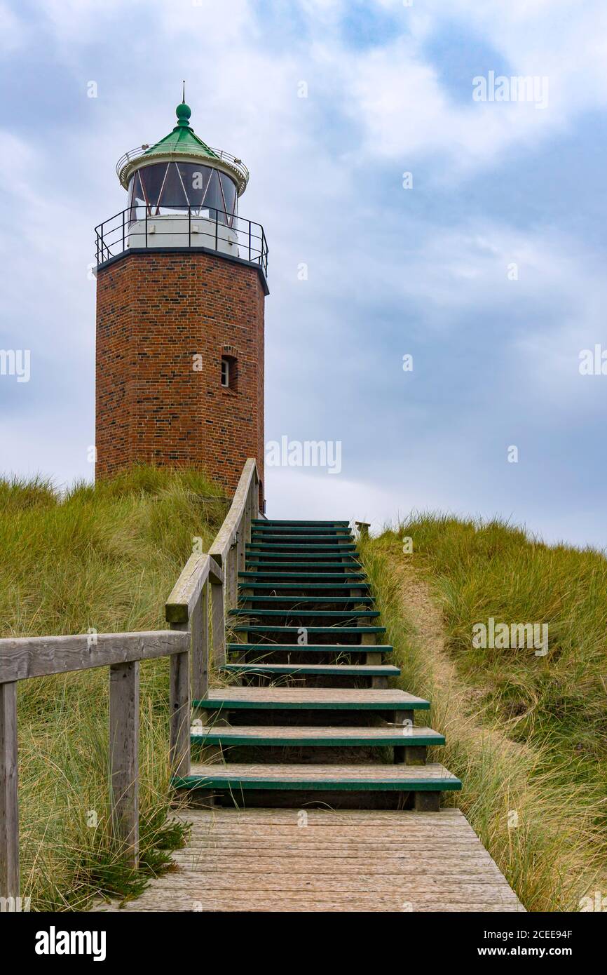 Wooden walkway to a small Lighthouse. Stock Photo