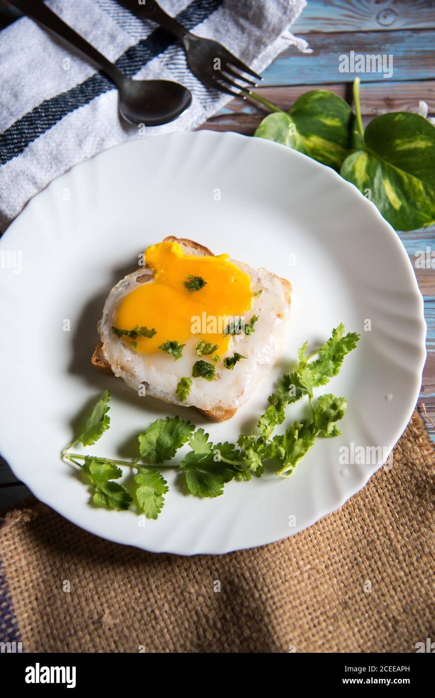 Eggs and bread with condiments as breakfast Stock Photo Alamy