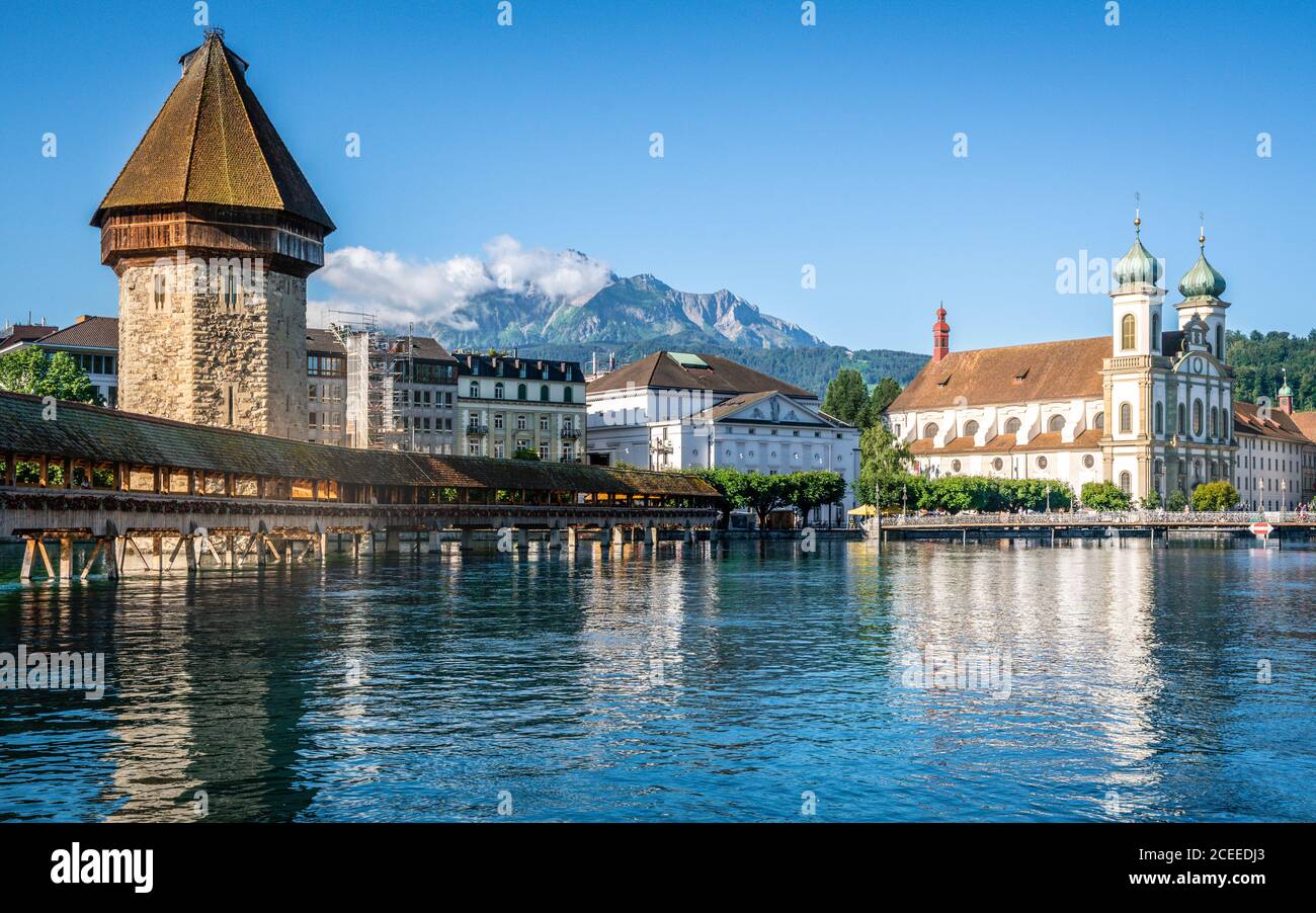 Scenic view of Lucerne old town with the Chapel bridge Pilatus mount and Jesuit church in Lucerne Switzerland Stock Photo