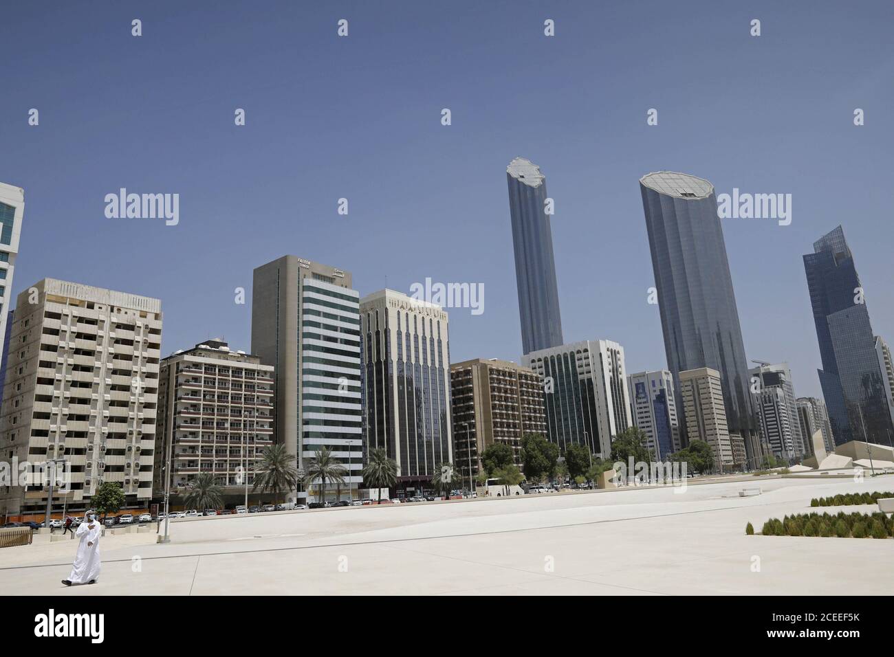 Abu Dhabi, United Arab Emirates. 01st Sep, 2020. An Emirati man wears a protective mask as he walks past buildings in Abu Dhabi, United Arab Emirates on Tuesday, September 1, 2020. An Israeli delegation and American officials visit the UAE for talks. Pool Photo by Nir Elias/UPI Credit: UPI/Alamy Live News Stock Photo