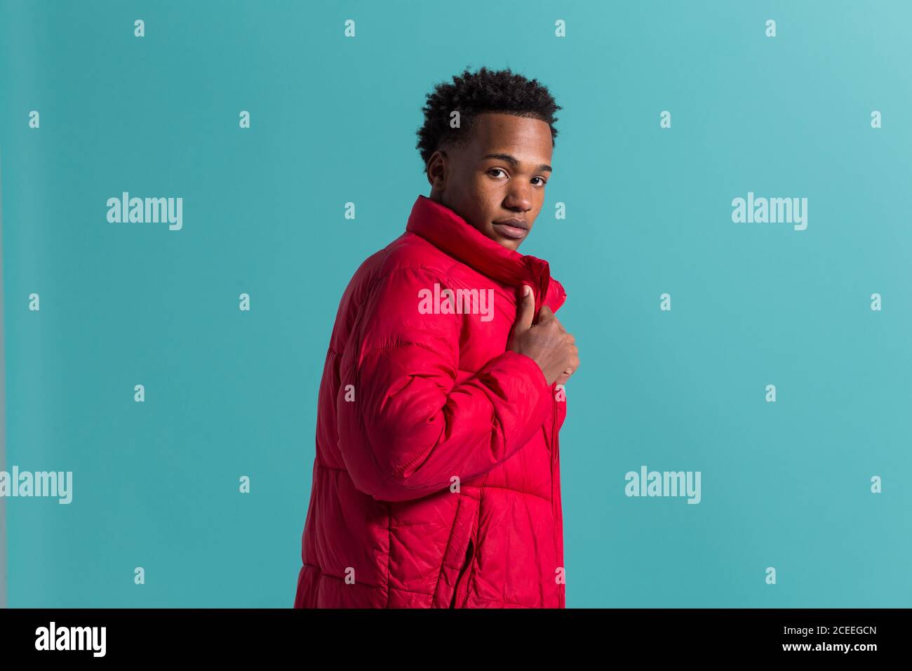 Trendy man in coat and headphones Stock Photo