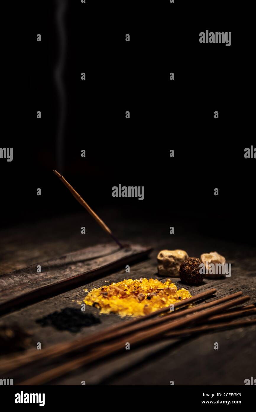 Joss sticks and esoteric and spiritually ingredients, incense and healing herbs, copyspace Stock Photo
