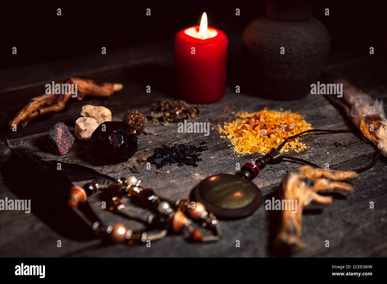 Voodoo or vodun ingredients for an dark ritual, witchcraft and african religion, talisman, incense, crow´s feet and gems Stock Photo