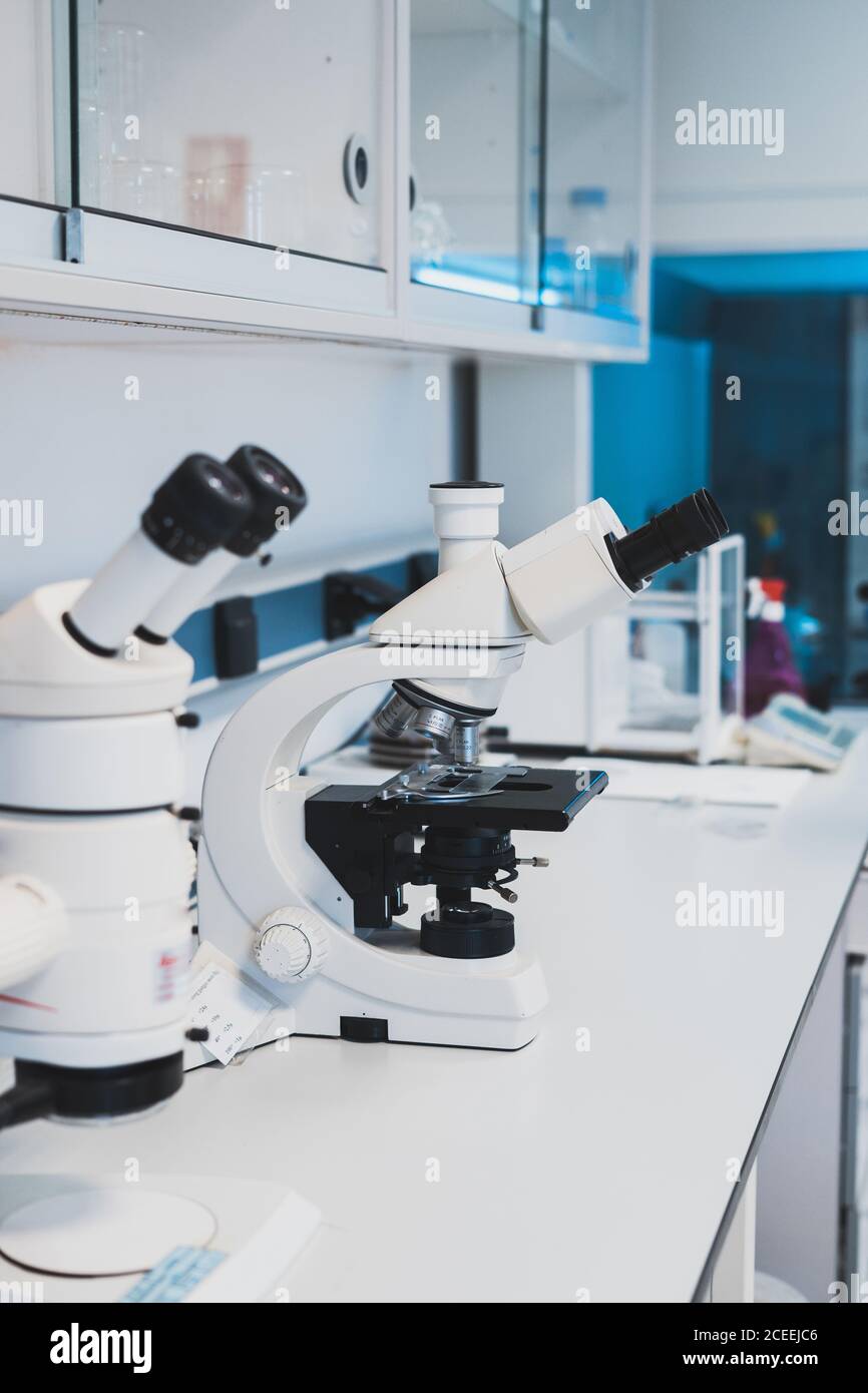 New white microscopes for medical research put on desk in laboratory Stock Photo