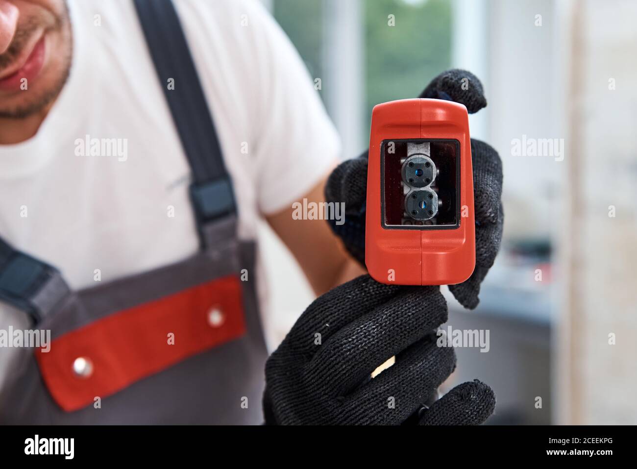 Male worker using laser level. Renovation concept Stock Photo