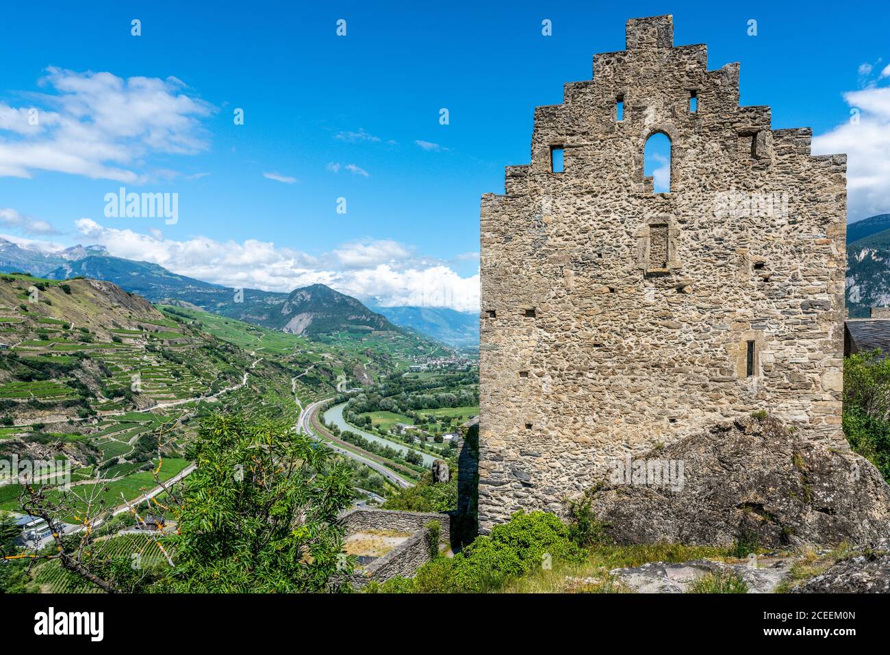 Panorama of the ruins of Tourbillon castle and aerial view of Valais canton with Rhone river and mountains in Sion Switzerland Stock Photo