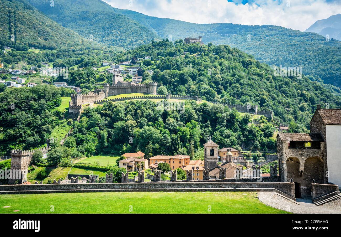 Bellinzona three castles view with wall of Castelgrande and panorama of Montebello and Sasso Corbaro in Bellinzona Ticino Switzerland Stock Photo