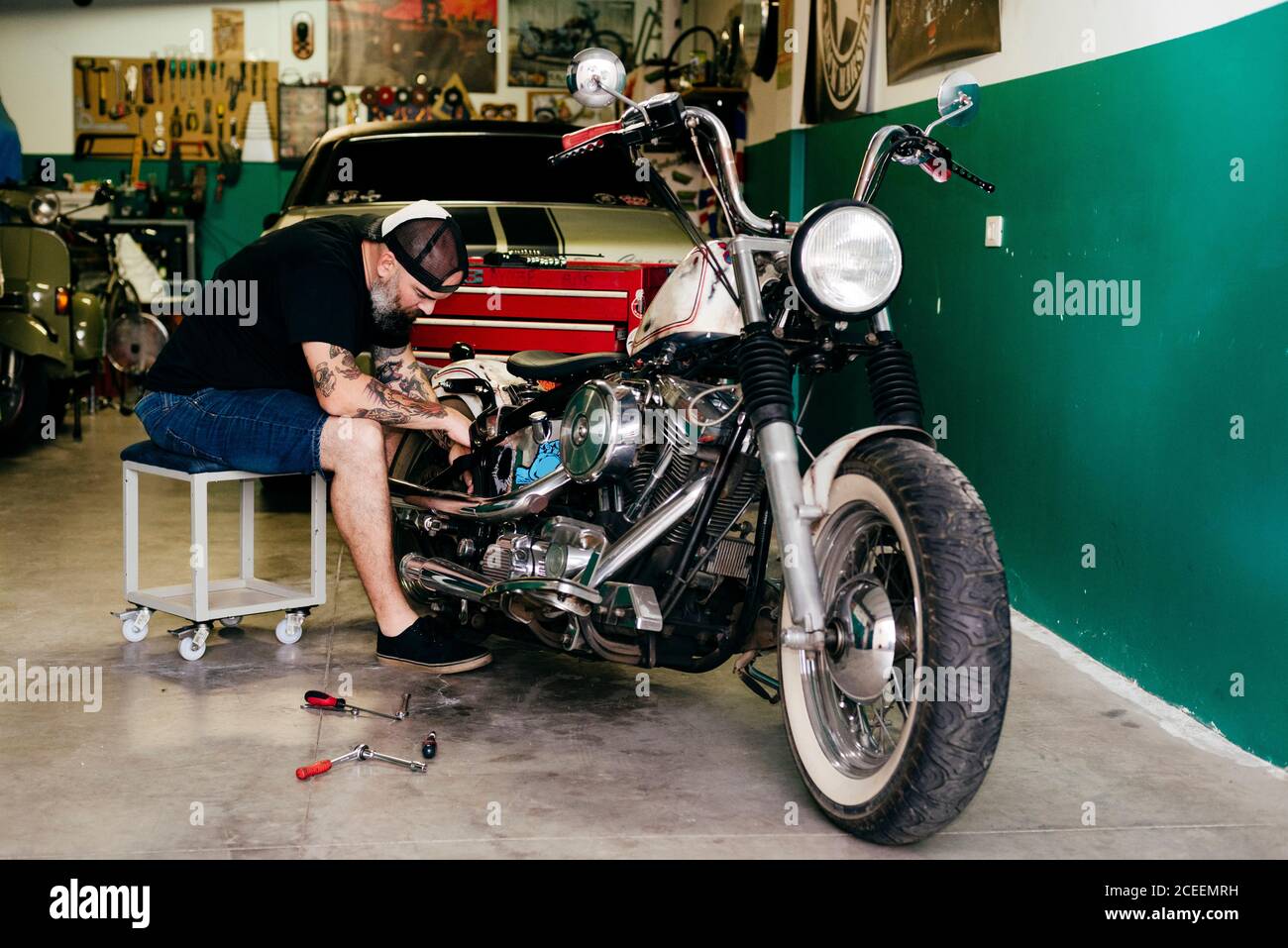 Mechanic repairing the motorcycle Stock Photo Alamy