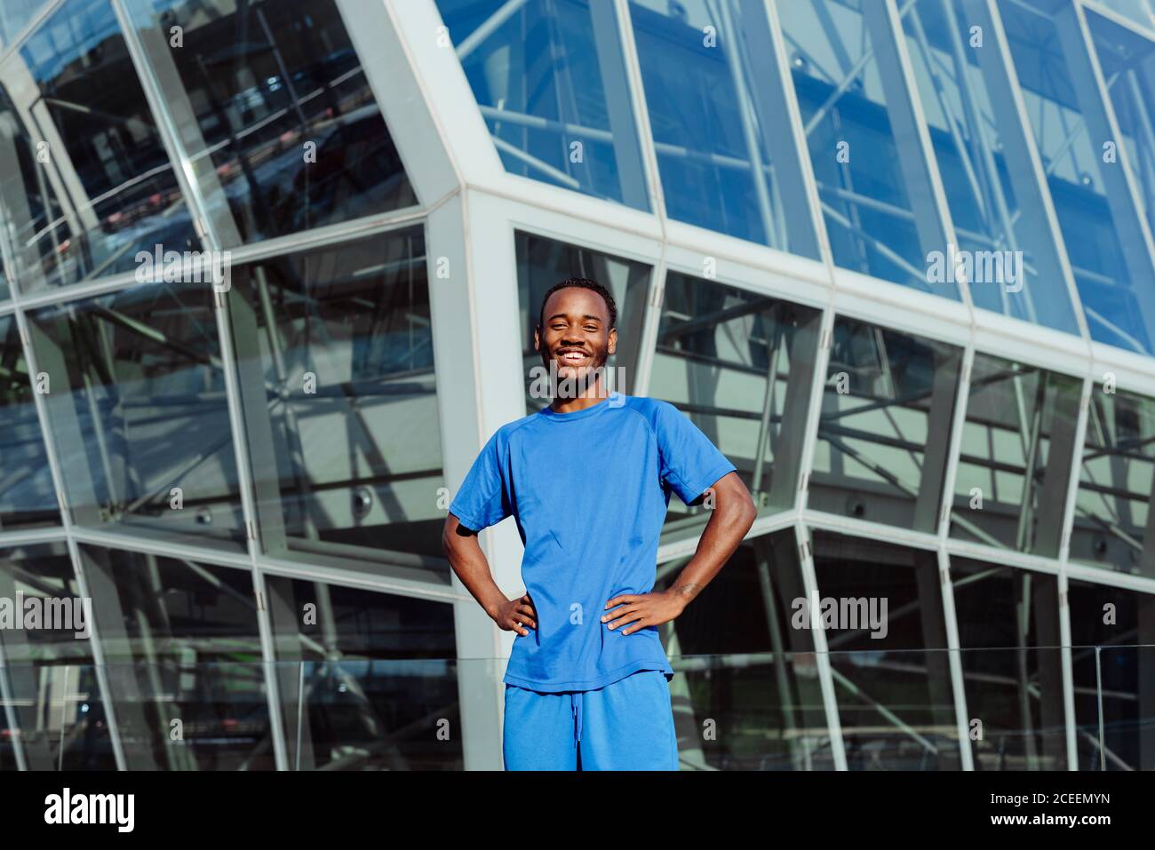 Handsome ethnic man posing in city Stock Photo