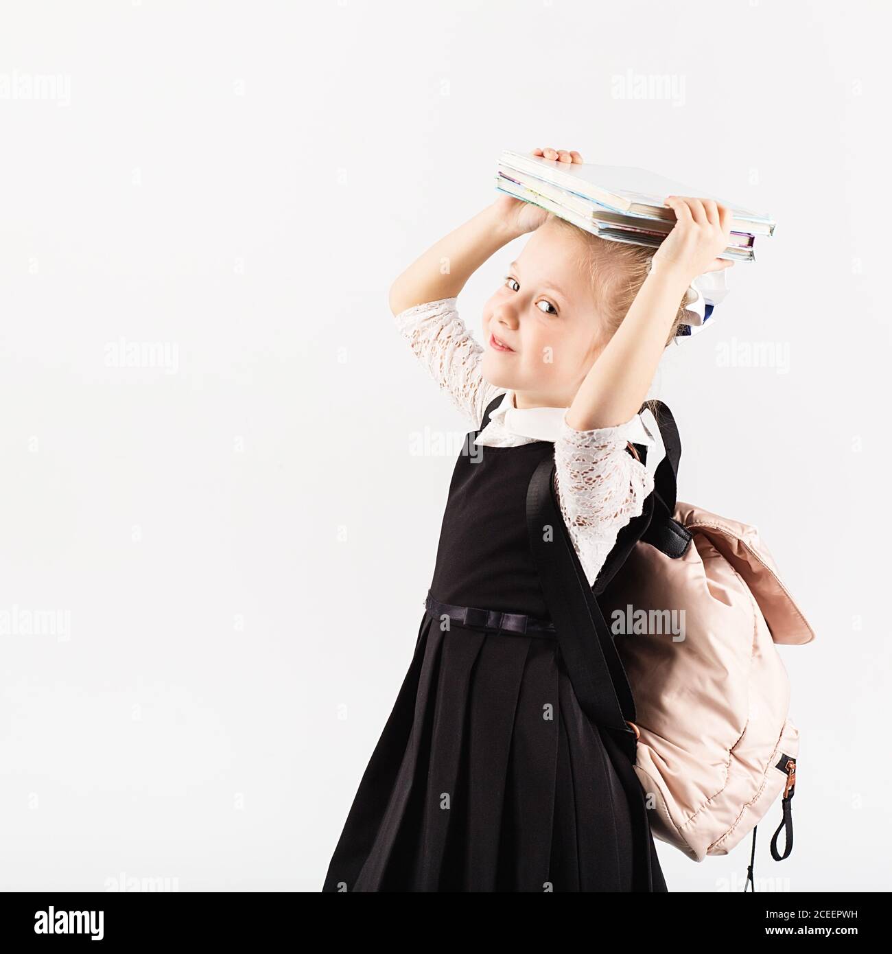 Book, school, kid. smiling little girl with big backpack holding books ...