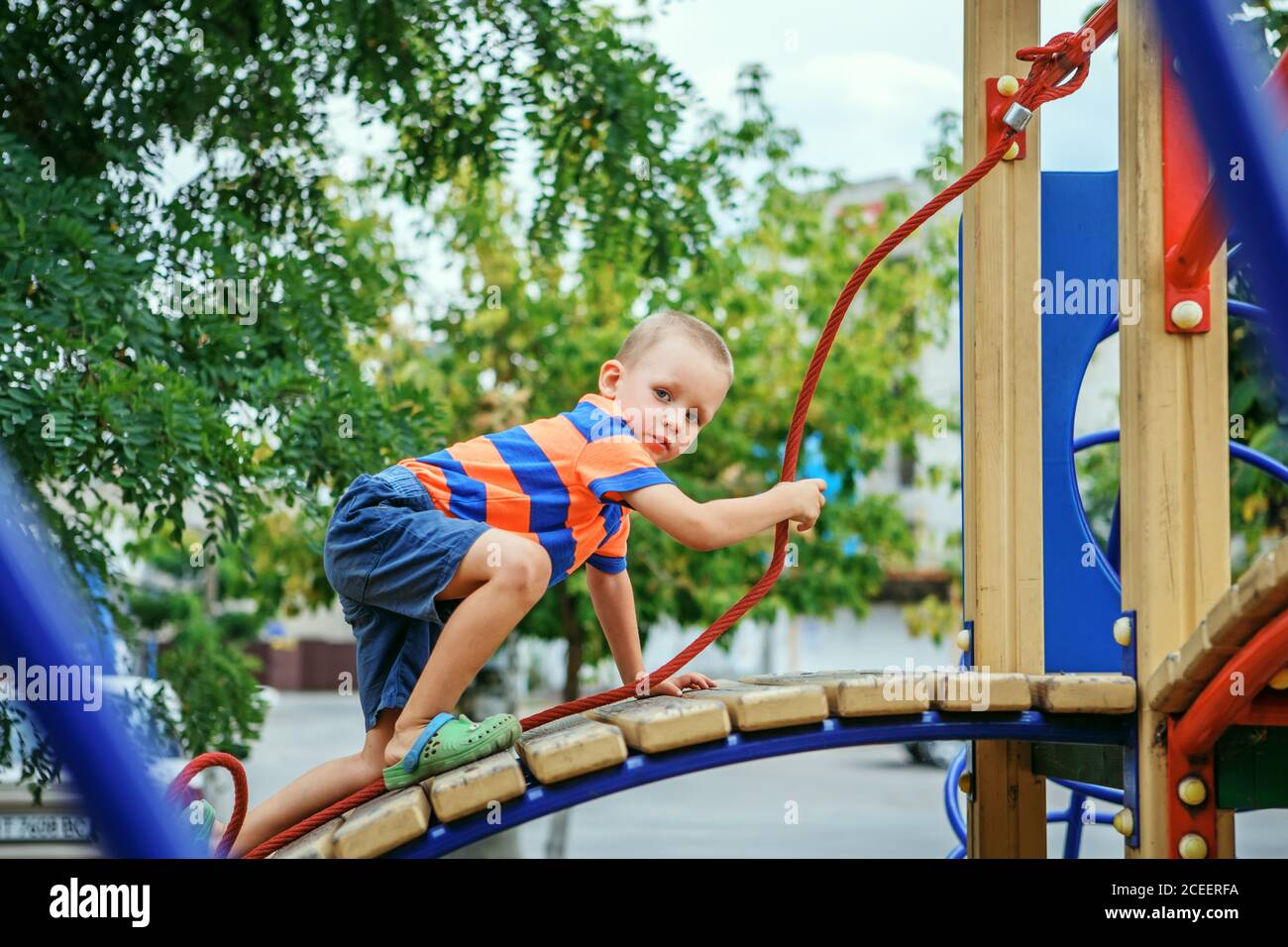 cute-little-boy-playing-on-the-playground-in-the-summer-in-the-city