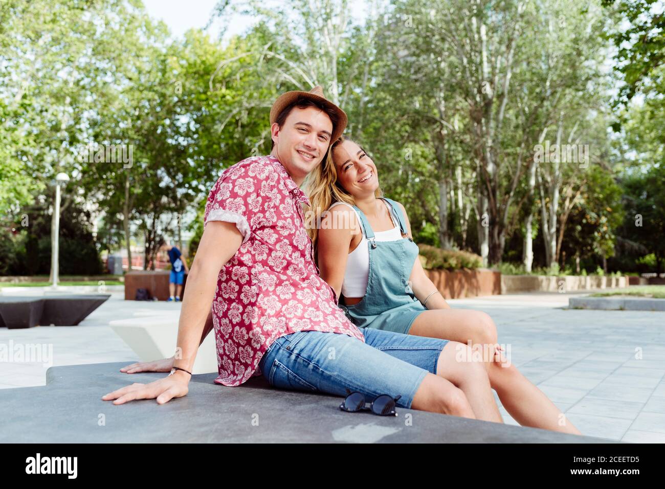 Couple sitting on bench Stock Photo