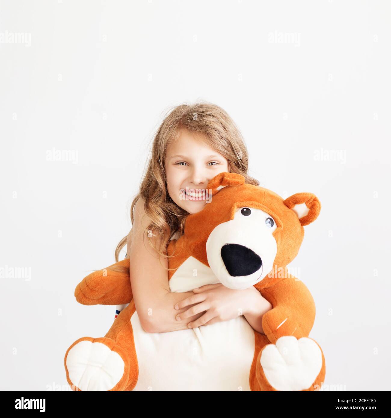 Little girl with big teddy bear having fun laughing Isolated on white ...