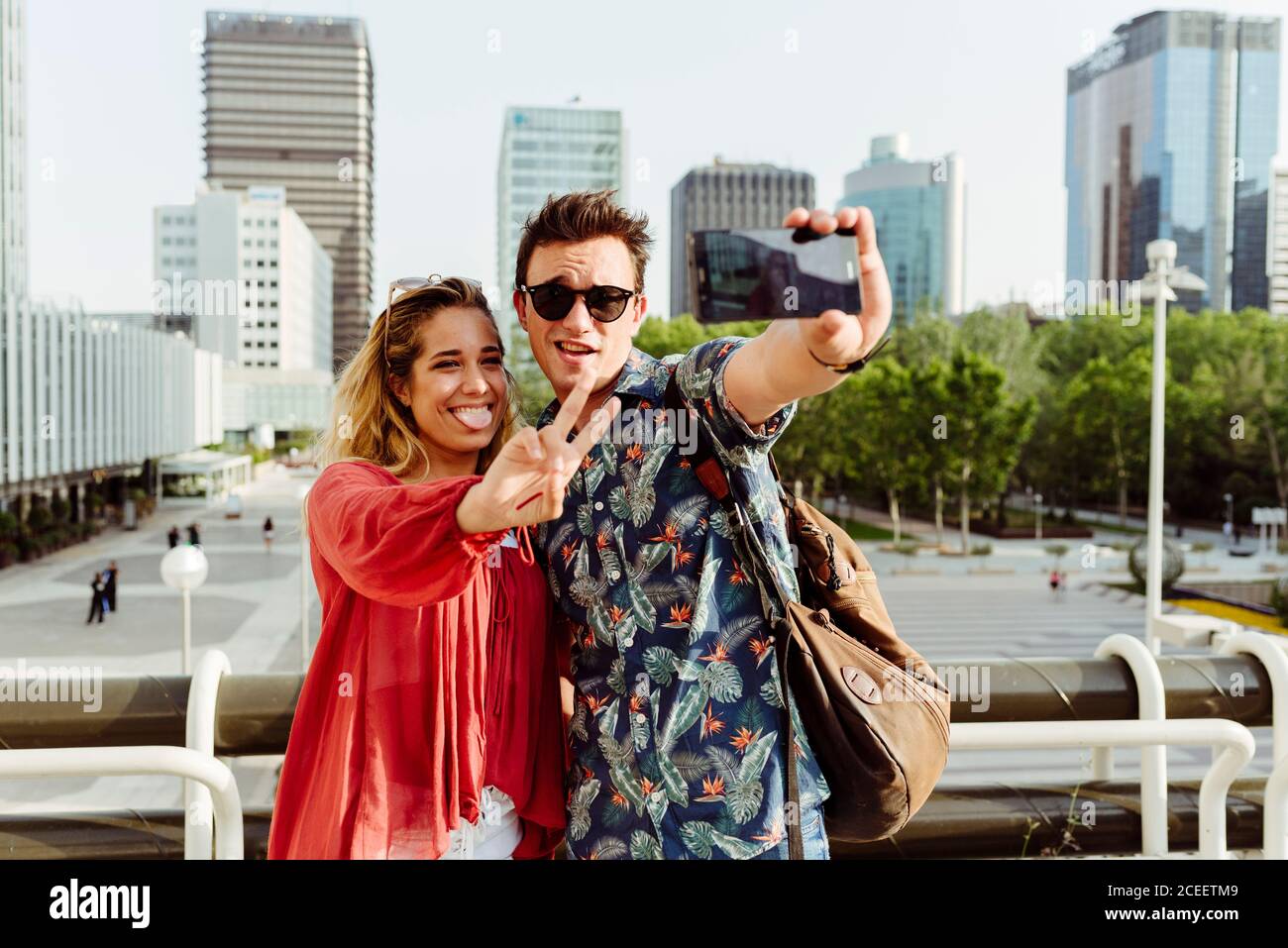 Couple taking selfie at handrail Stock Photo