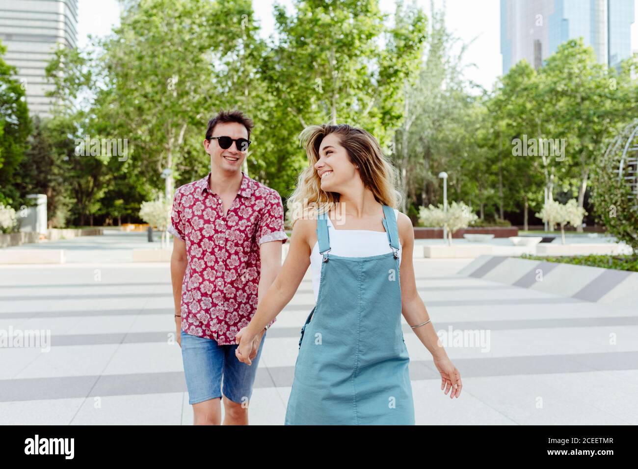 Couple walking holding hands hi-res stock photography and images - Alamy