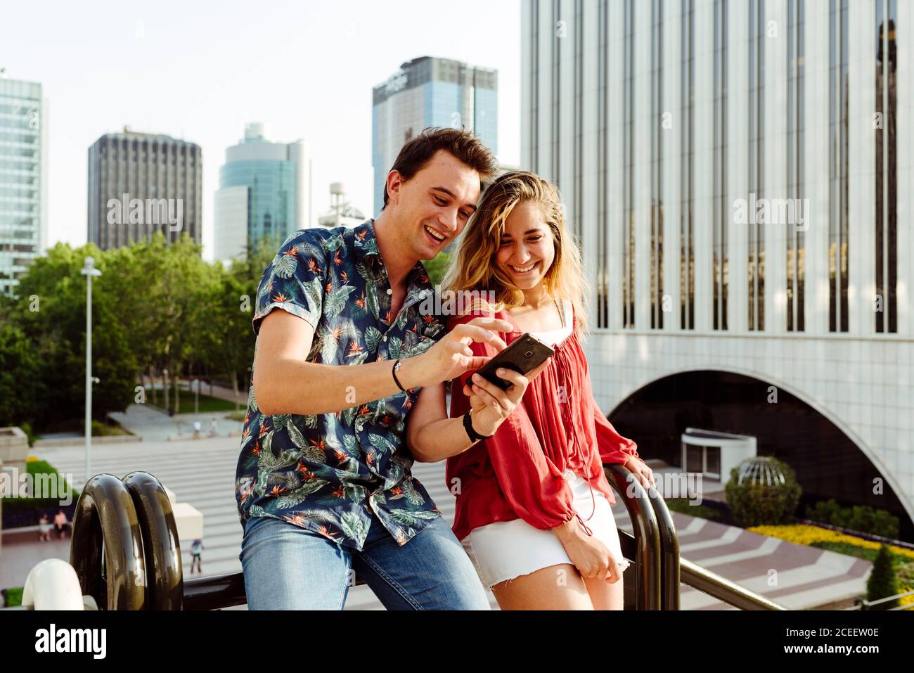 Couple taking selfie at handrail Stock Photo
