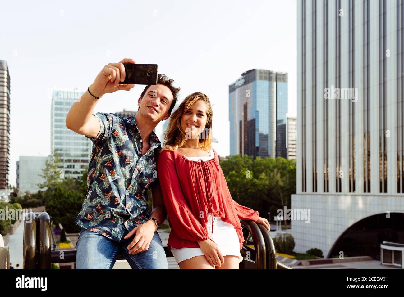 Couple taking selfie at handrail Stock Photo
