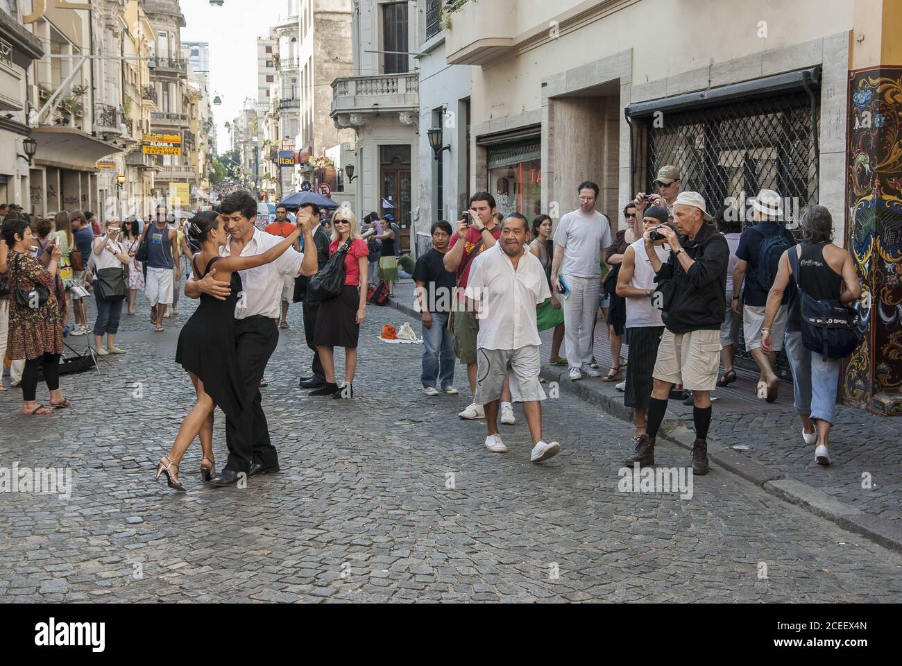BUENOS AIRES, ARGENTINA - Mar 30, 2009: A couple of dancers does a street tango performance in Defensa Street in San Telmo, the oldest district in Bue Stock Photo