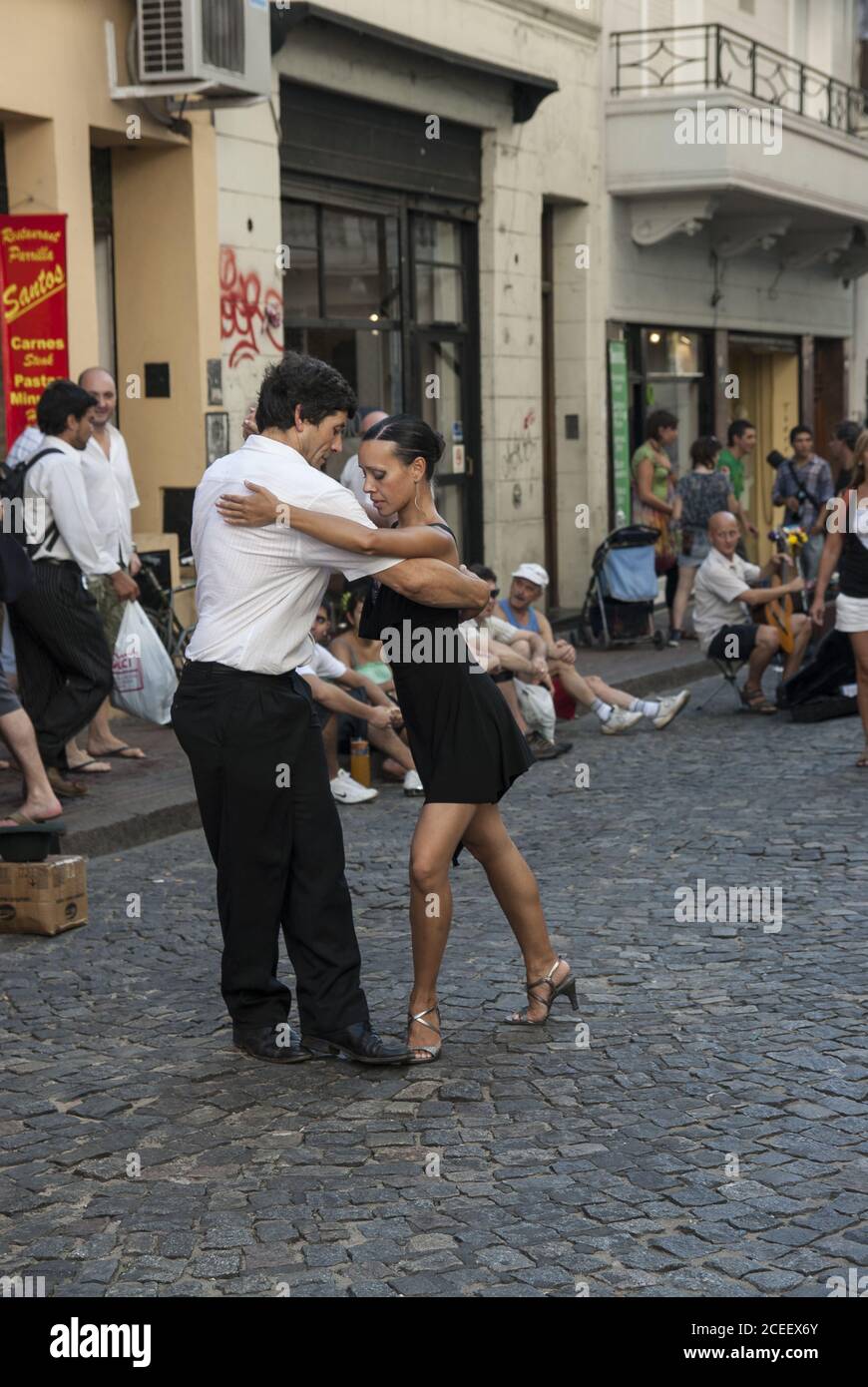 BUENOS AIRES, ARGENTINA - Mar 30, 2009: A couple of dancers does a street tango performance in Defensa Street in San Telmo, the oldest district in Bue Stock Photo