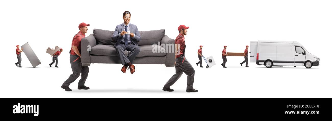 Movers carrying a couch with a man sitting and drinking coffee while other movers loading a van isolated on white background Stock Photo