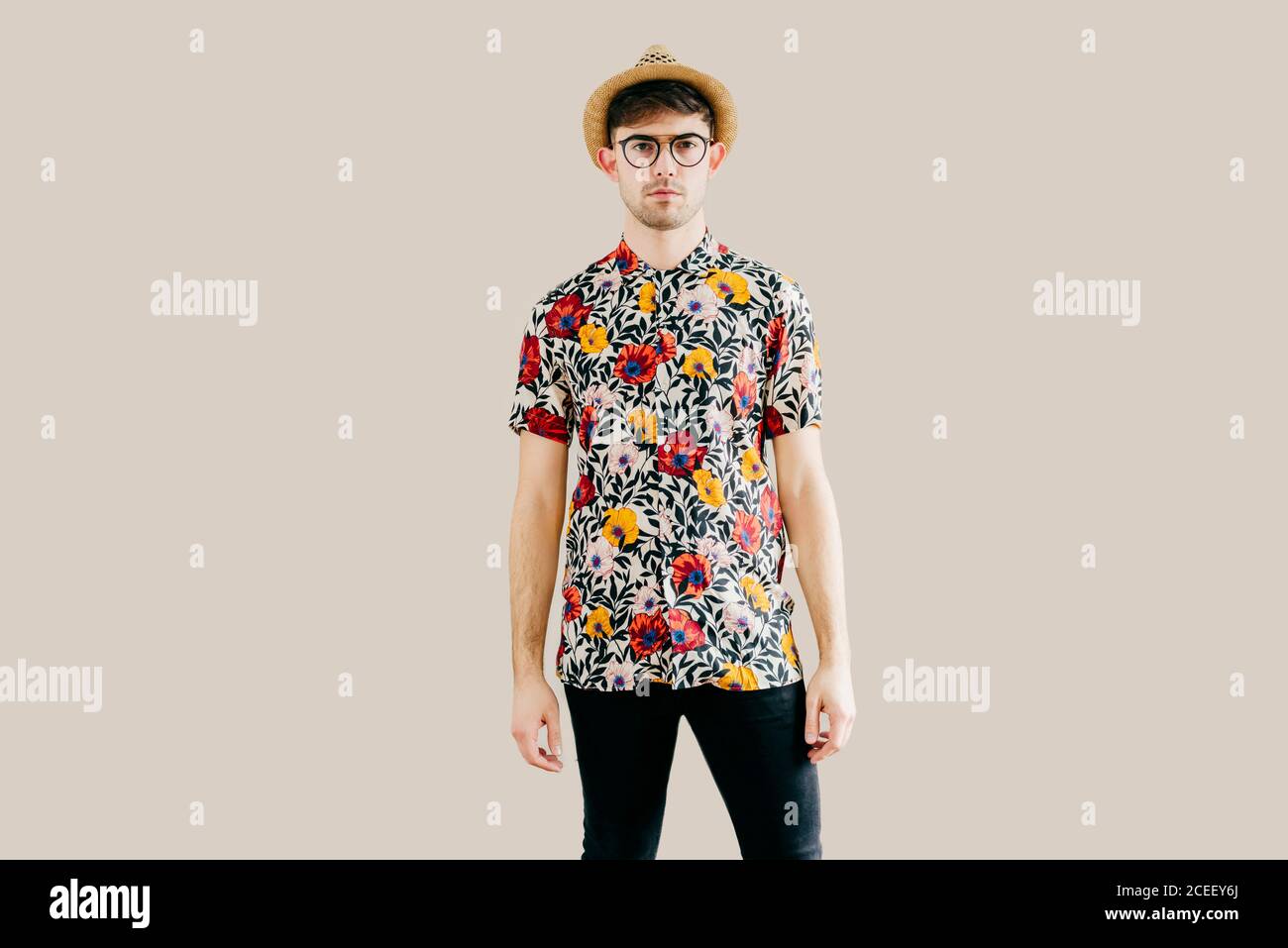 Young stylish man posing at white wall Stock Photo