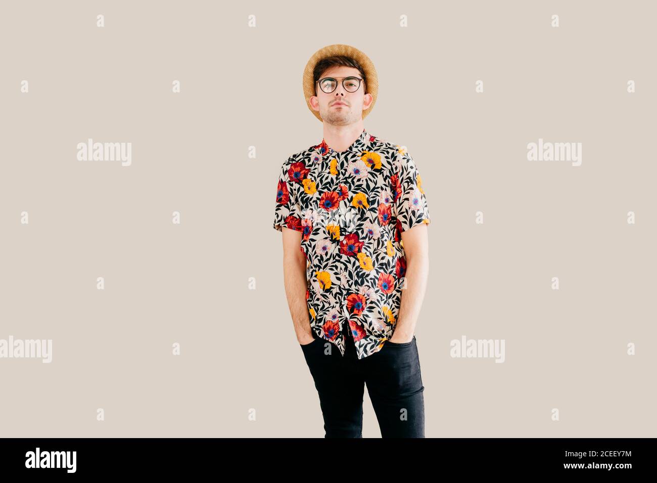 Young stylish man posing at white wall Stock Photo