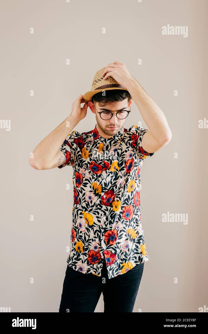 Young stylish man posing at white wall Stock Photo