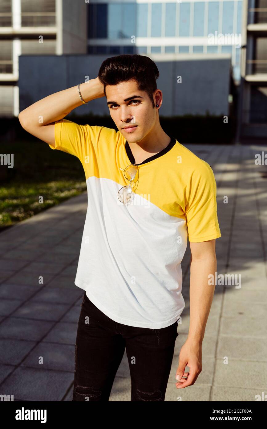Handsome young man standing in city Stock Photo