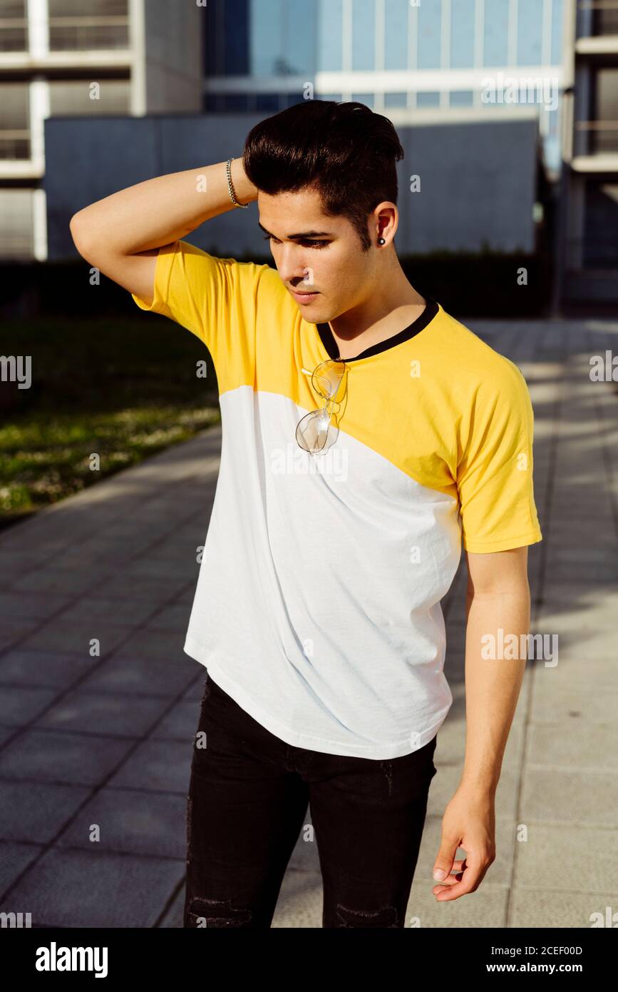Handsome young man standing in city Stock Photo