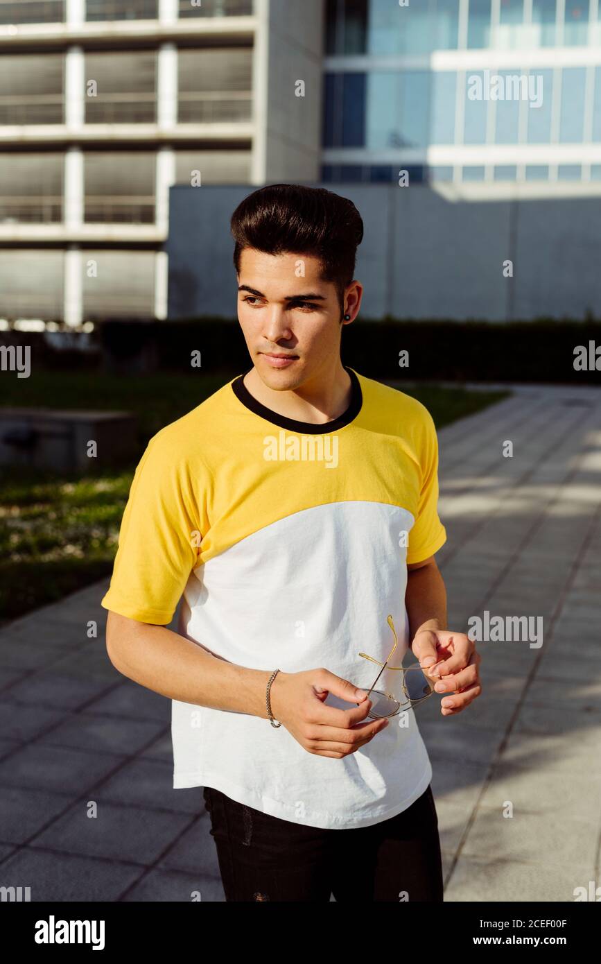 Handsome young man standing in city Stock Photo