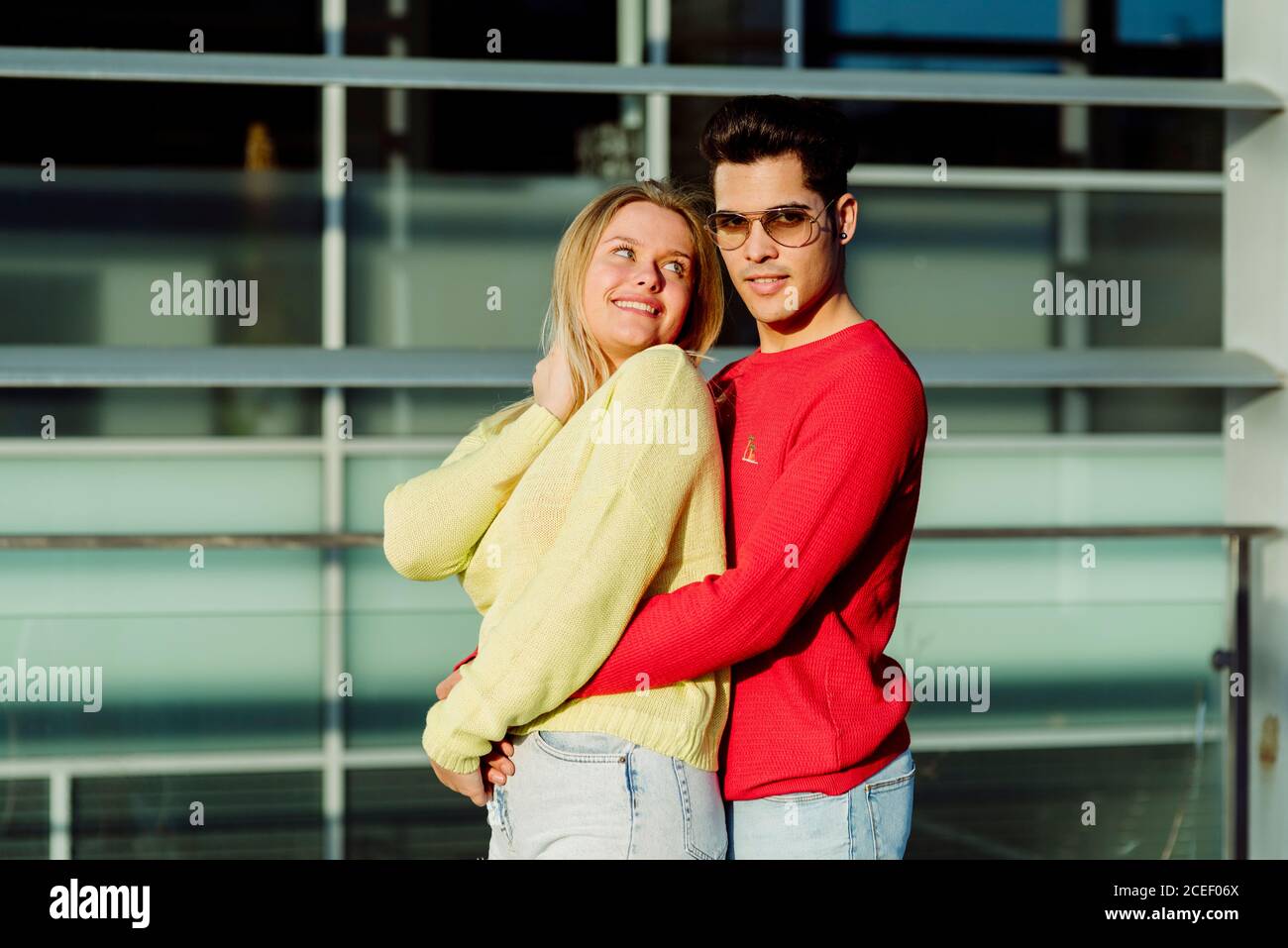 Young couple hugging in city Stock Photo