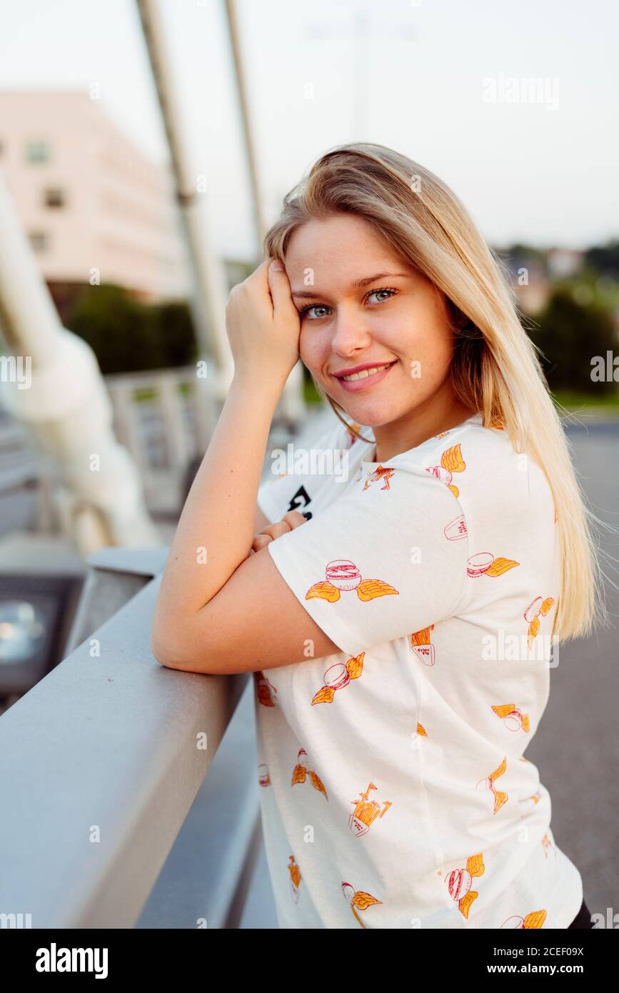 Young Woman standing on bridge Stock Photo