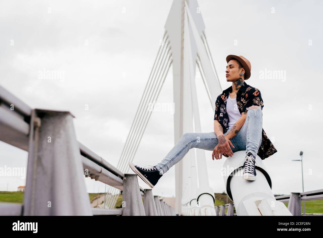 Man sitting on bridge looking hi-res stock photography and images - Alamy