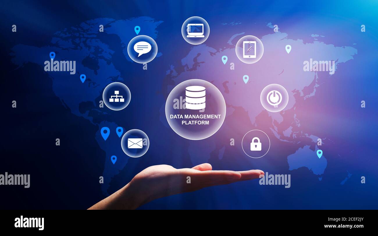 Male hand holding bubble with data management platform text and different multimedia icons Stock Photo