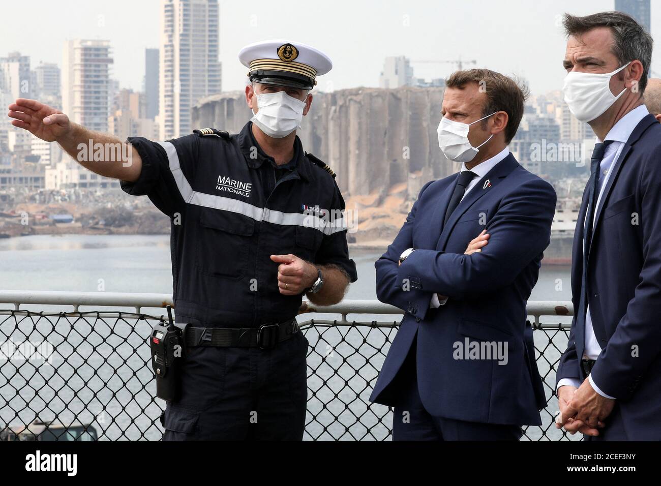 French President Emmanuel Macron speaks with Arnaud Tranchant, commander of the Tonnerre helicopter carrier, as he meets with UN representatives and NGOs mobilised for the reconstruction of the port of Beirut, in Beirut, Lebanon September 1, 2020. Stephane Lemouton/Pool via REUTERS Stock Photo