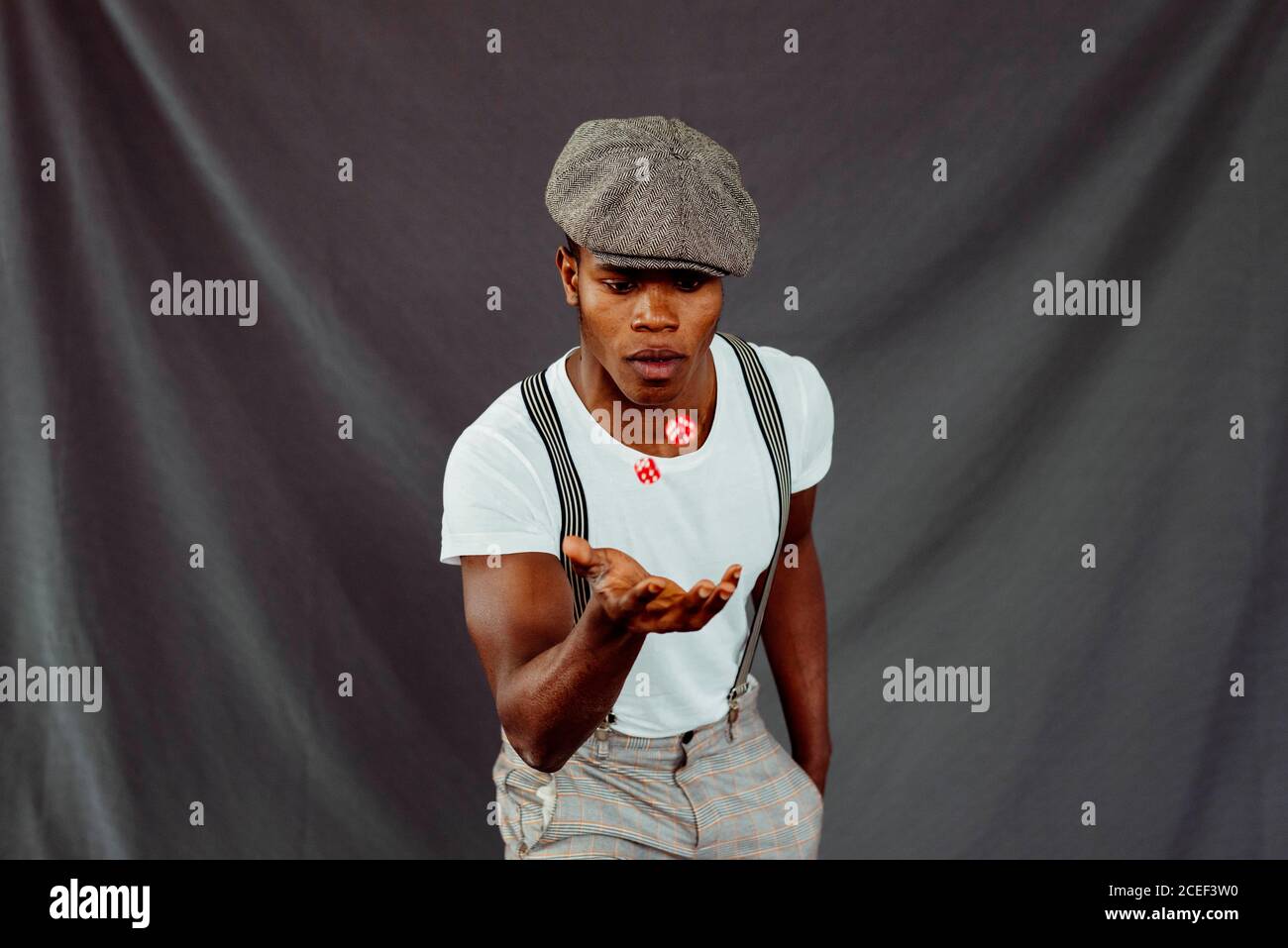 African-American man throwing up dices Stock Photo