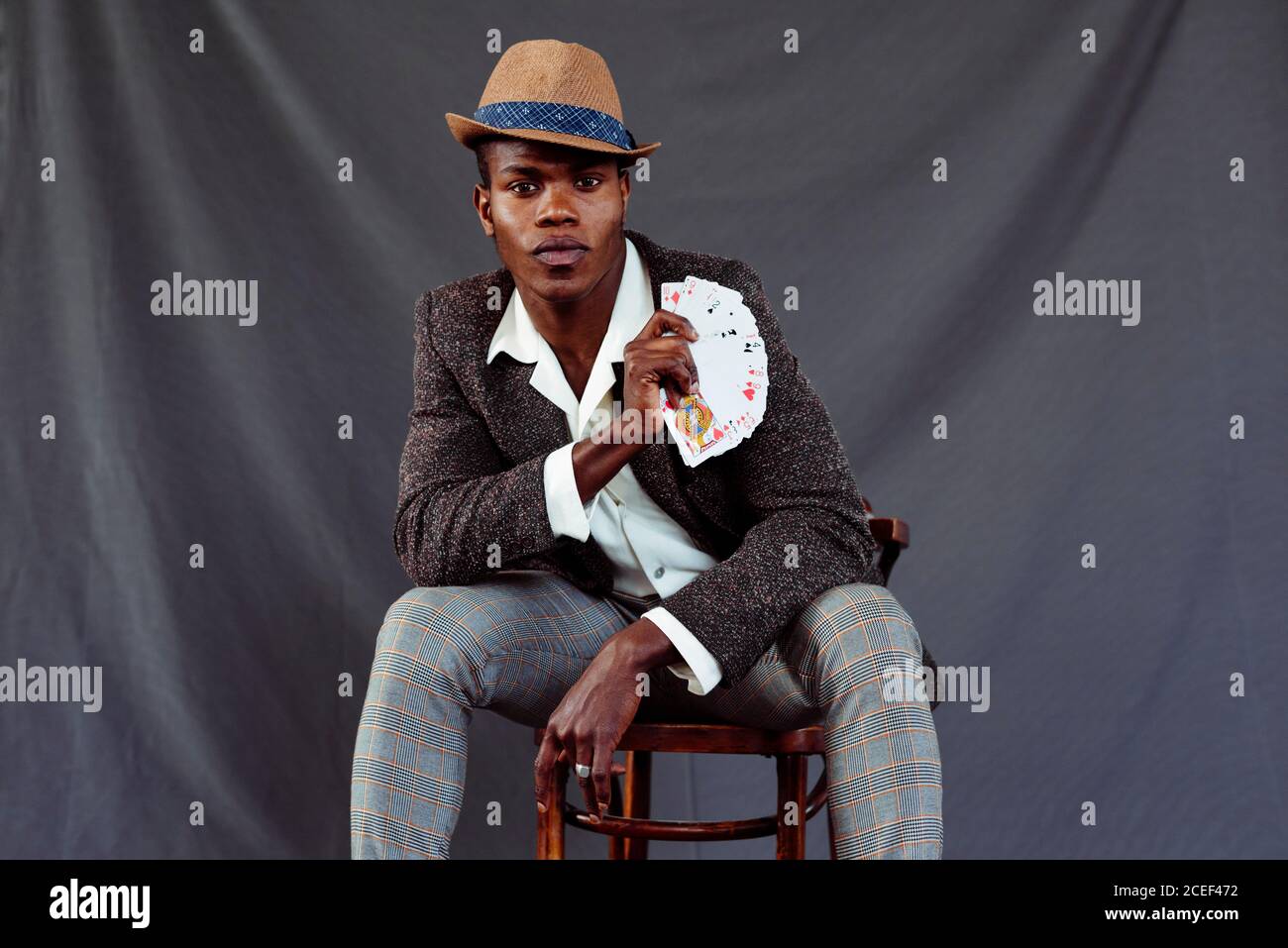 Handsome man with playing cards Stock Photo