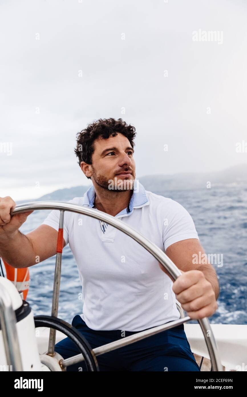 captain-of-a-ship-sailing-on-a-sailboat-stock-photo-alamy