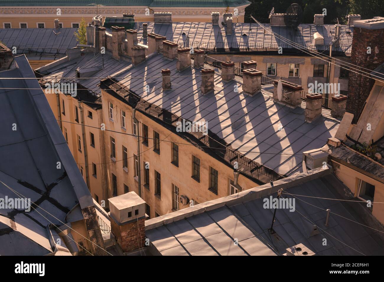 European houses at golden hour from rooftop, roof walk at sunset in