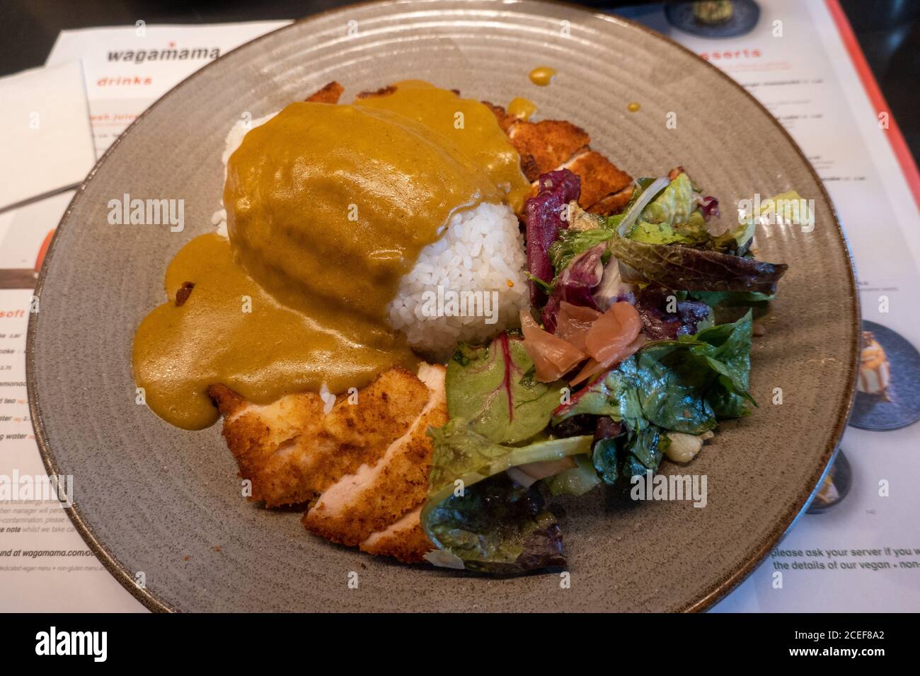 Chicken Katsu Curry in Wagamamma Restaurant Stock Photo