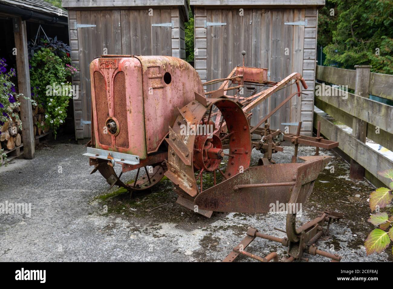 Old farm equipment at the Turtley Corn Mill Restaurant, Avonwick, Devon Stock Photo