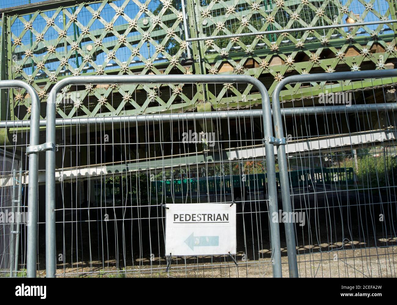 barriers preventing access to the towpath beneath hammersmith bridge, london, england, following structural safety issues during bridge repair Stock Photo