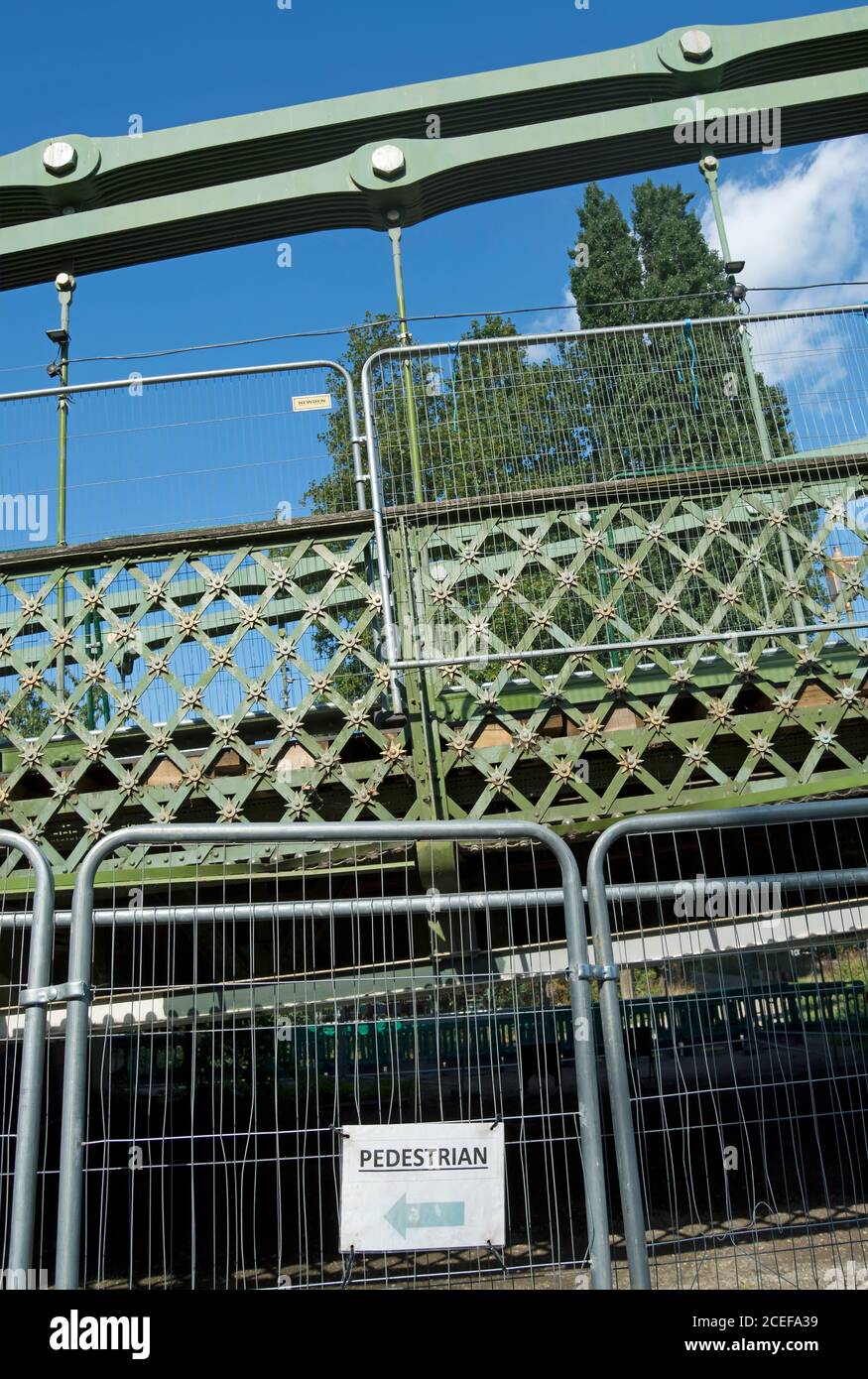 barriers preventing access to the towpath beneath hammersmith bridge, london, england, following structural safety issues during bridge repair Stock Photo