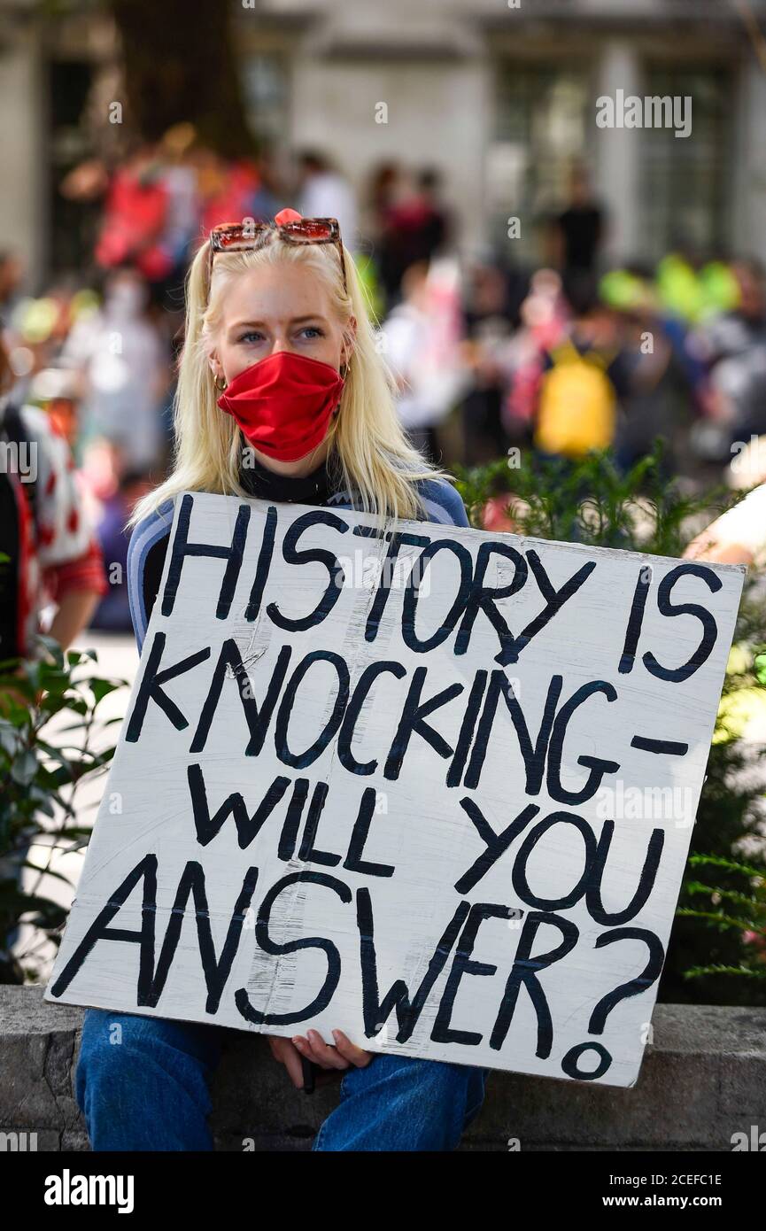 London, UK.  1 September 2020.  An activist from Extinction Rebellion takes part in a climate change protest in Parliament Square on the day that Members of Parliament return to Westminster after the summer recess. Credit: Stephen Chung / Alamy Live News Stock Photo