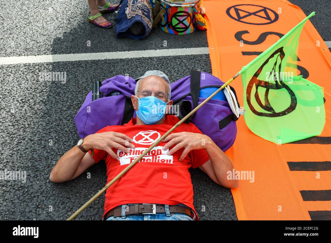 London, UK.  1 September 2020.  A (sleeping) activist from Extinction Rebellion takes part in a climate change protest in Parliament Square on the day that Members of Parliament return to Westminster after the summer recess. Credit: Stephen Chung / Alamy Live News Stock Photo